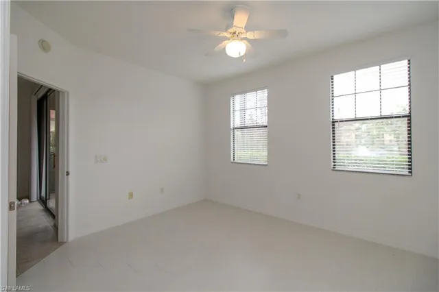 a bathroom with a granite countertop sink toilet and mirror