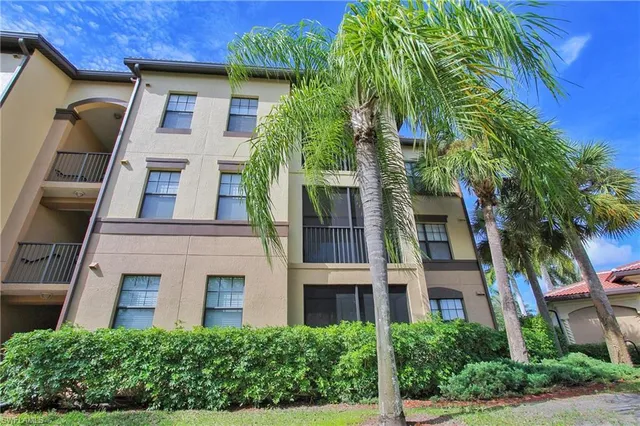 a view of a building with a yard