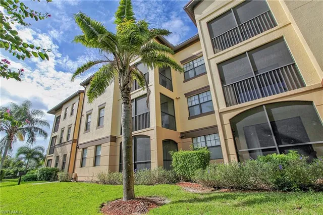 a view of a kitchen with refrigerator and a sink