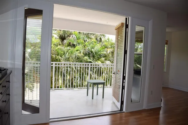 a view of a porch with a floor to ceiling window