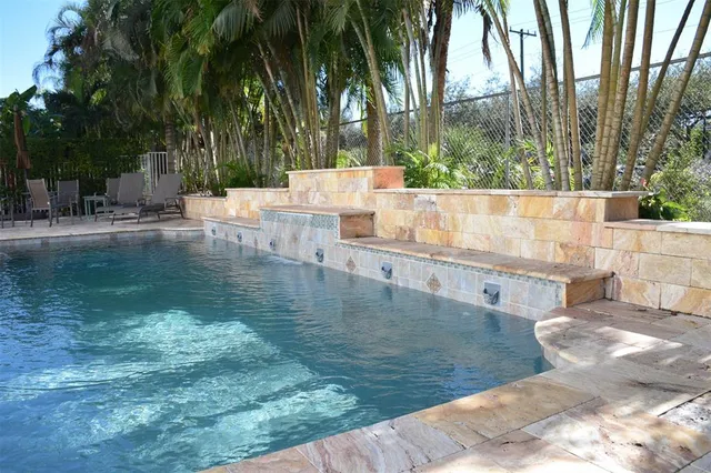 a view of a swimming pool with a patio