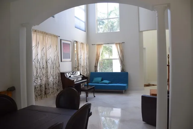 a living room with furniture and a window