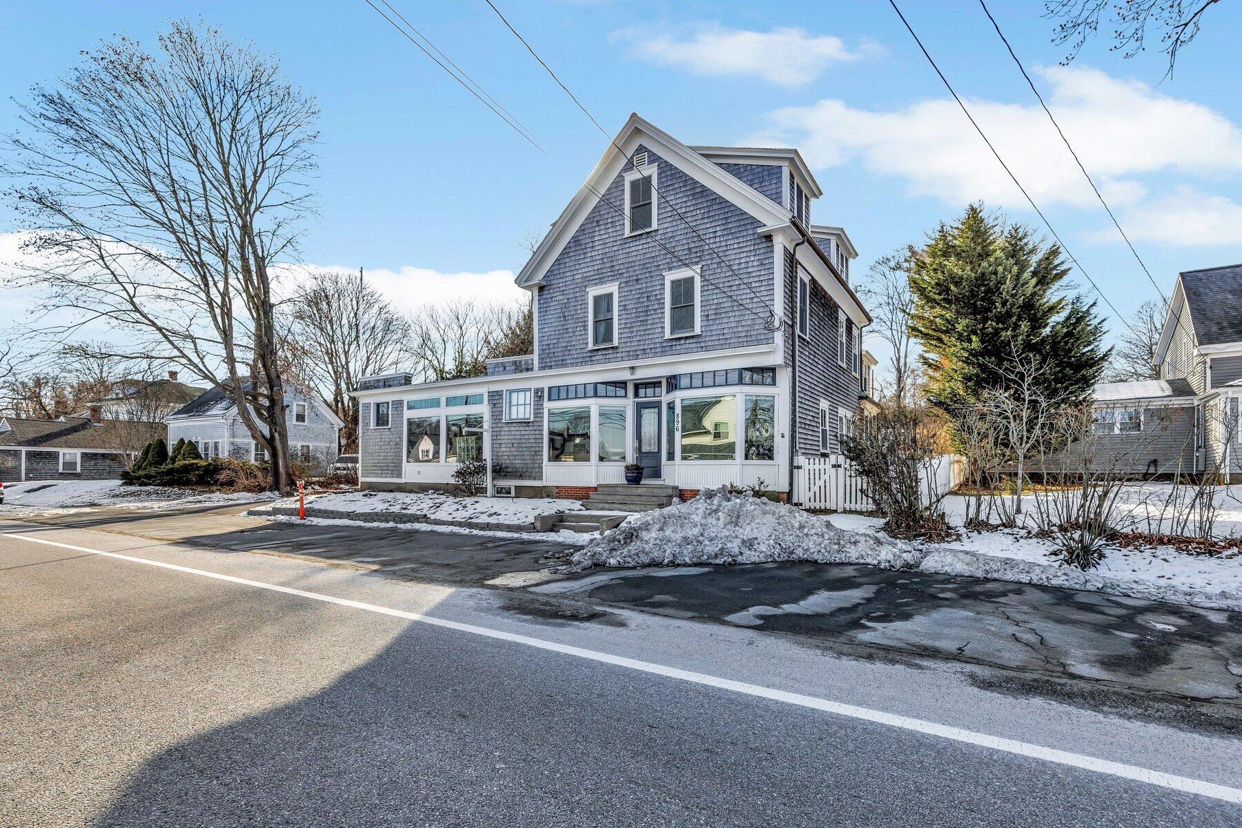 896 Sandwich Road Sagamore, MA 02561 - Photo 26 of 32 a front view of residential houses with yard and trees