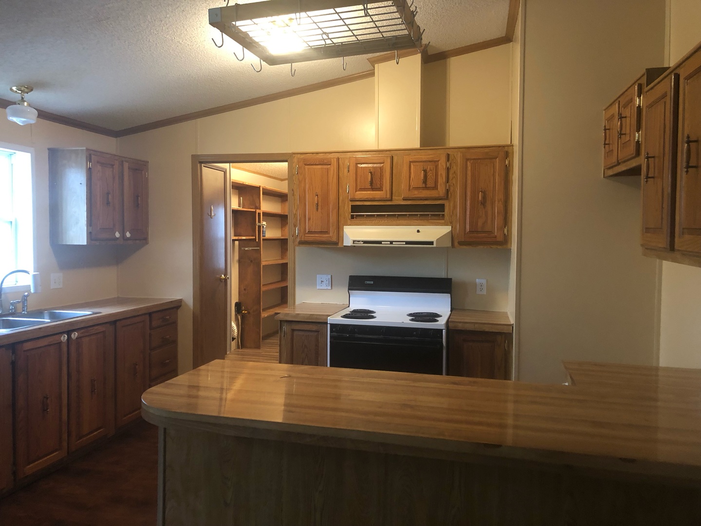 772 North 3906 Th Road Triumph, IL 61371 - Photo 8 of 14 a kitchen with a stove and a refrigerator