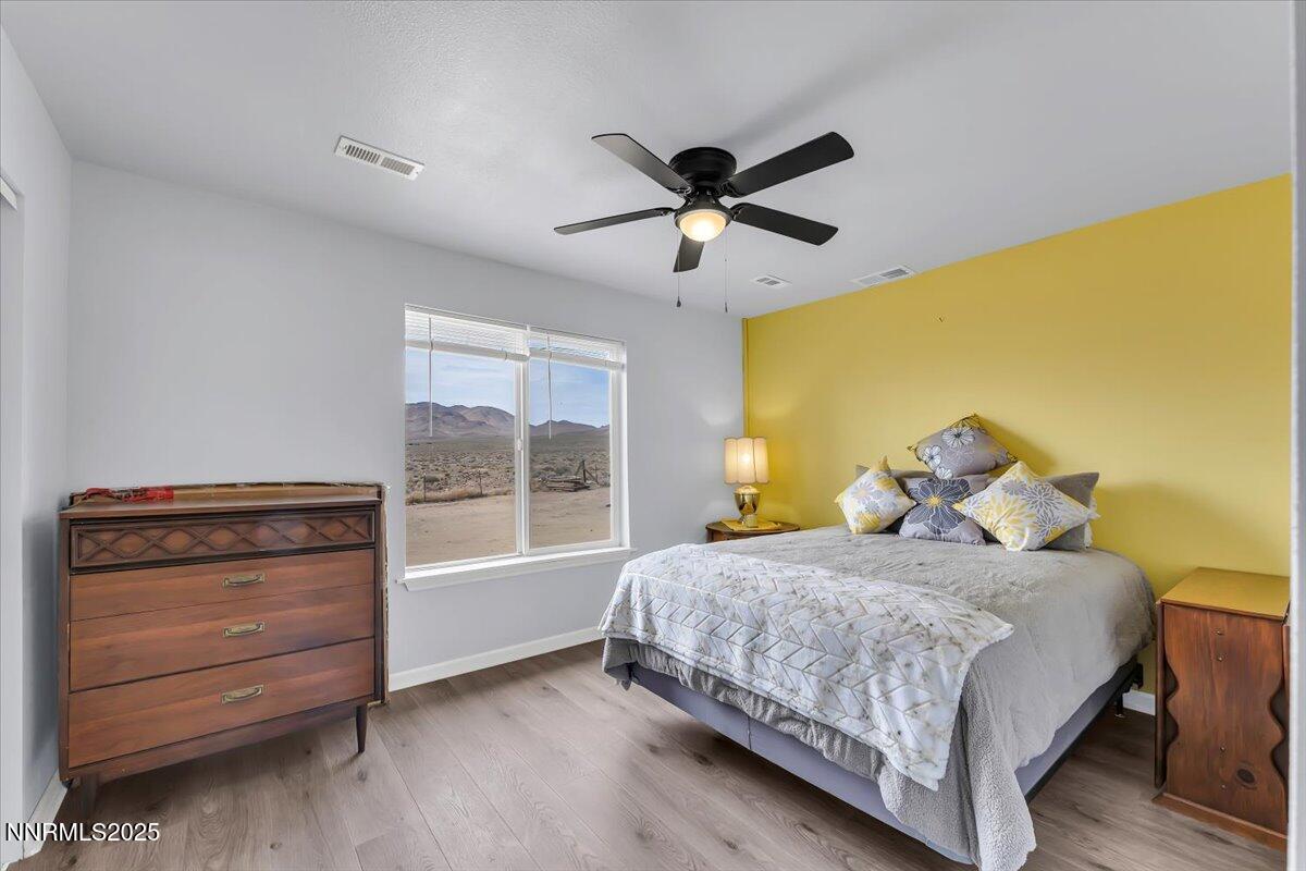 4895 Cheyenne Trail Stagecoach, NV 89429 - Photo 17 of 52 a bedroom with a bed and a window
