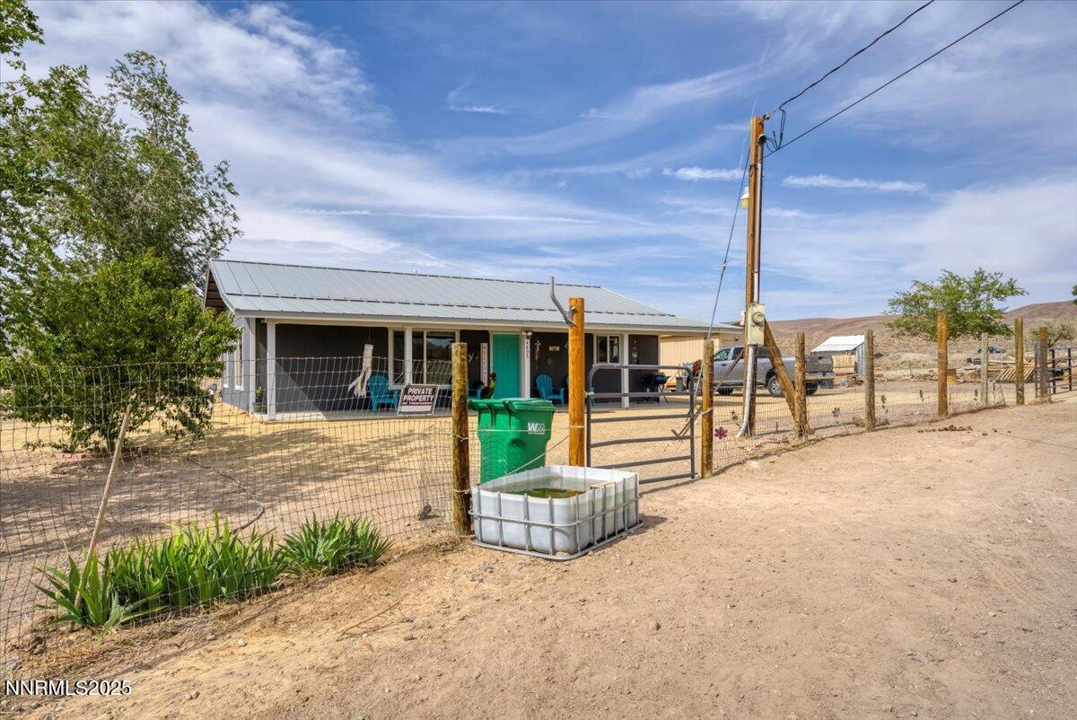 4895 Cheyenne Trail Stagecoach, NV 89429 - Photo 43 of 52 a view of a house with backyard and porch