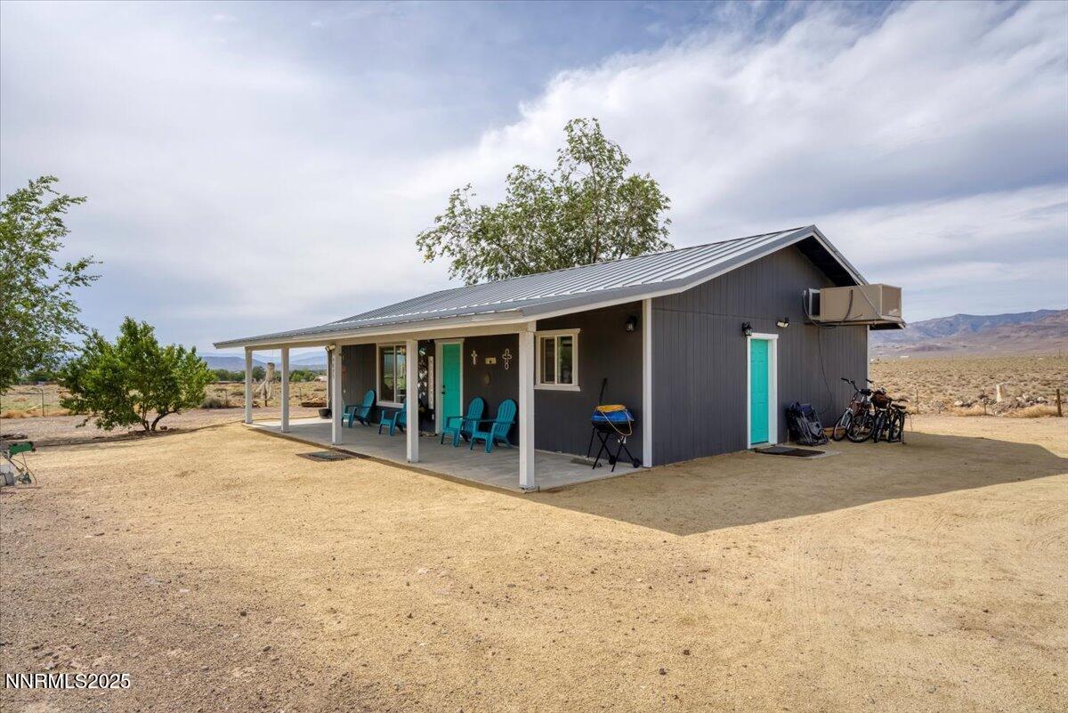 4895 Cheyenne Trail Stagecoach, NV 89429 - Photo 47 of 52 a view of a house with backyard and sitting area
