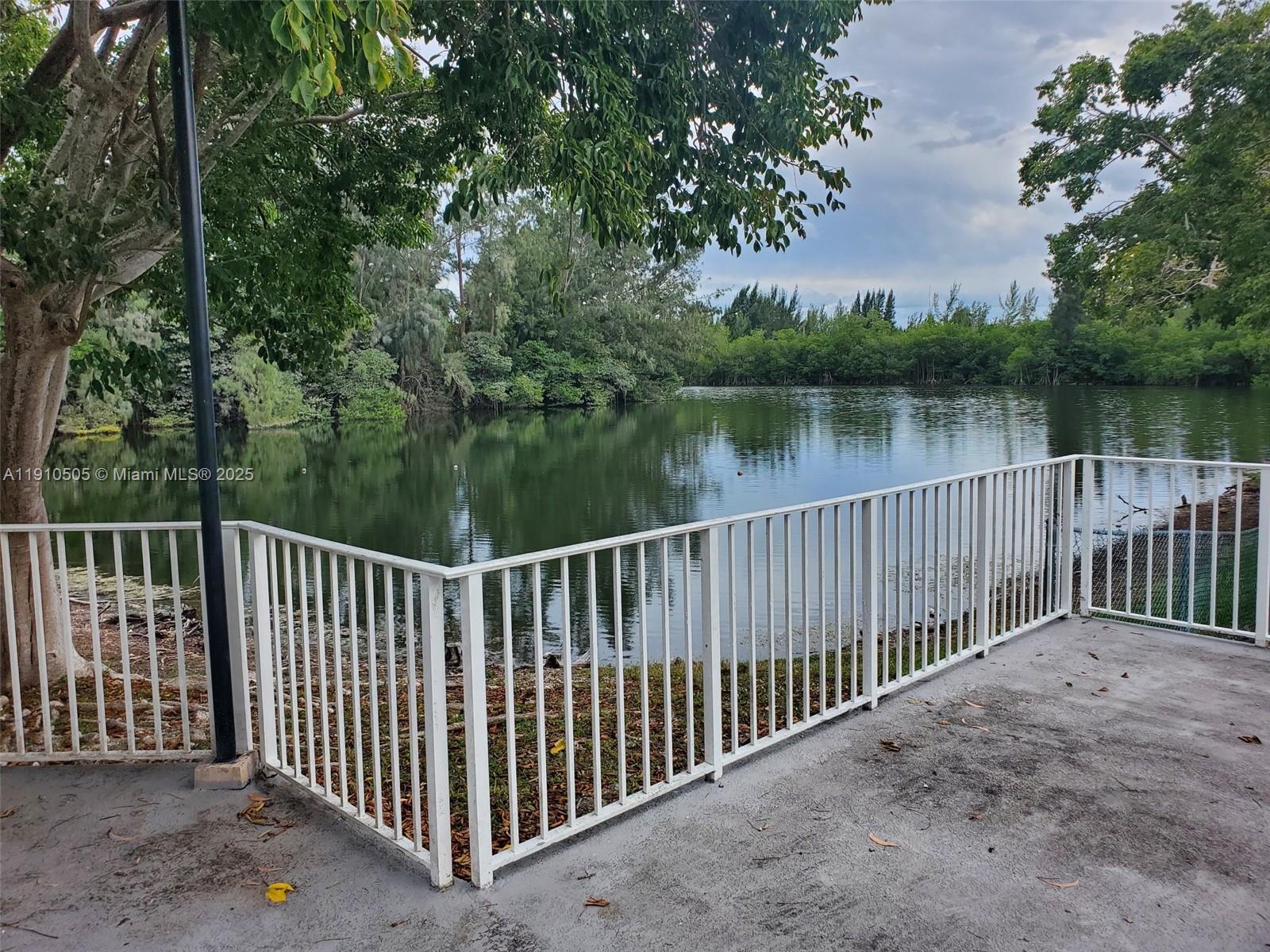 8260 Southwest 210th Street, Unit 217 Cutler Bay, FL 33189 - Photo 19 of 19 a balcony with lake view