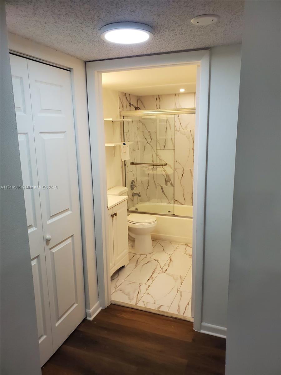 8260 Southwest 210th Street, Unit 217 Cutler Bay, FL 33189 - Photo 8 of 19 a bathroom with a toilet and a shower