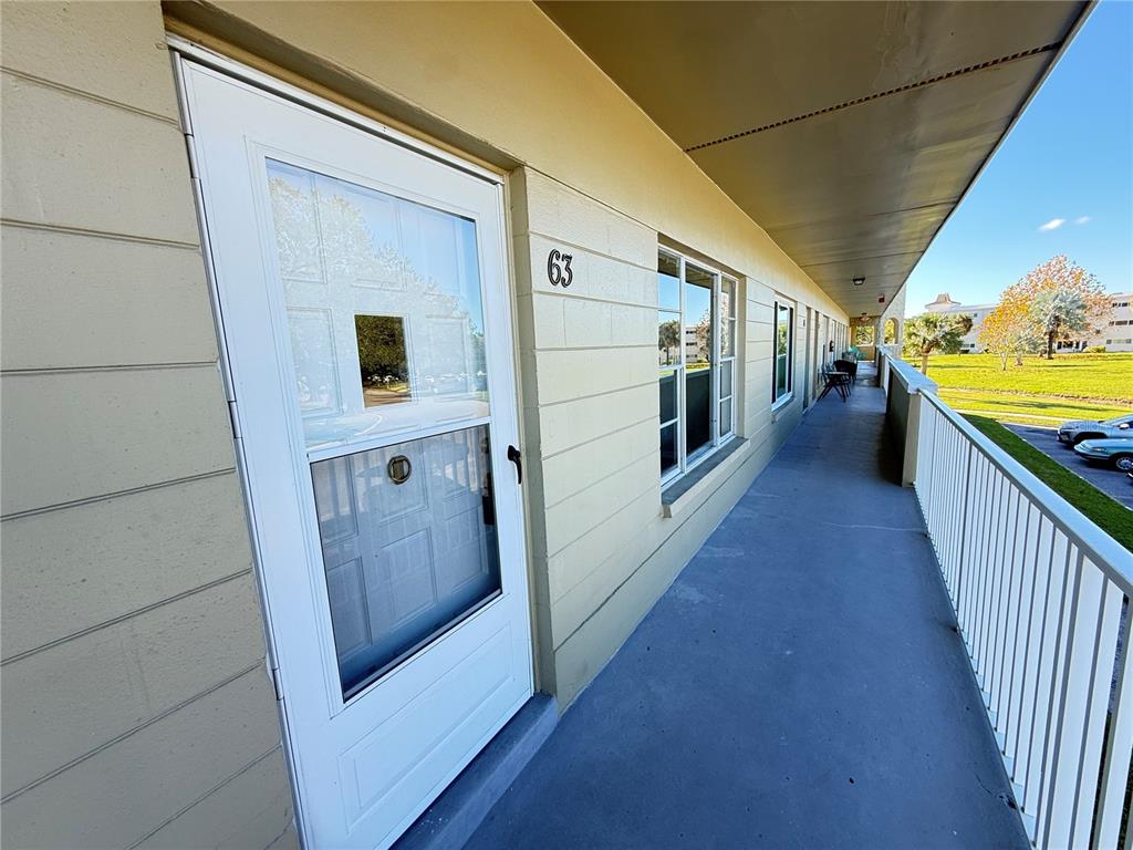 2391 Sumatran Way, Unit 63 Clearwater, FL 33763 - Photo 15 of 15 a view of a hallway with wooden floor