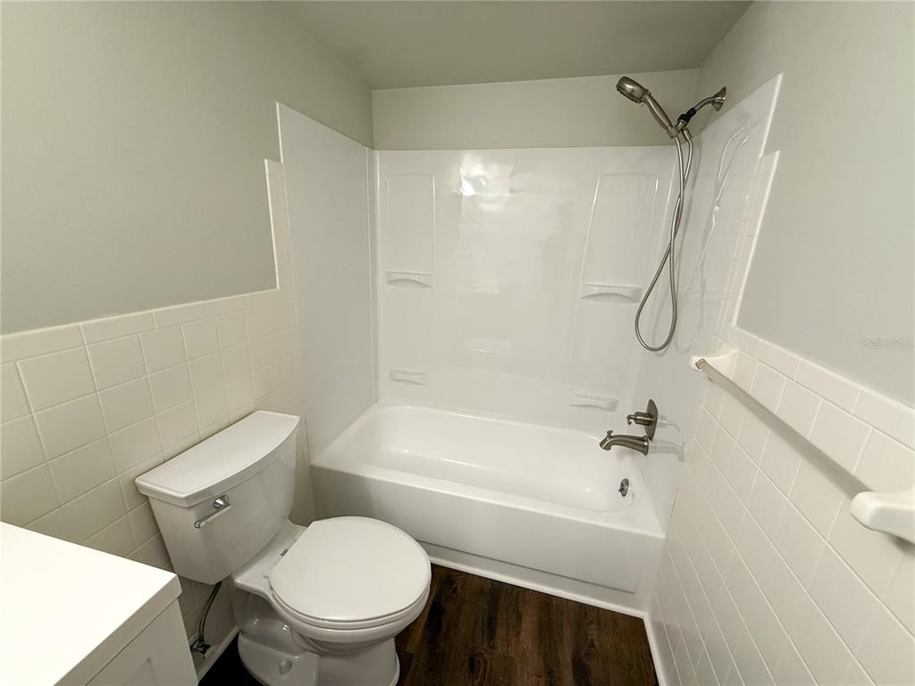 2391 Sumatran Way, Unit 63 Clearwater, FL 33763 - Photo 8 of 15 a bathroom with a toilet and a shower