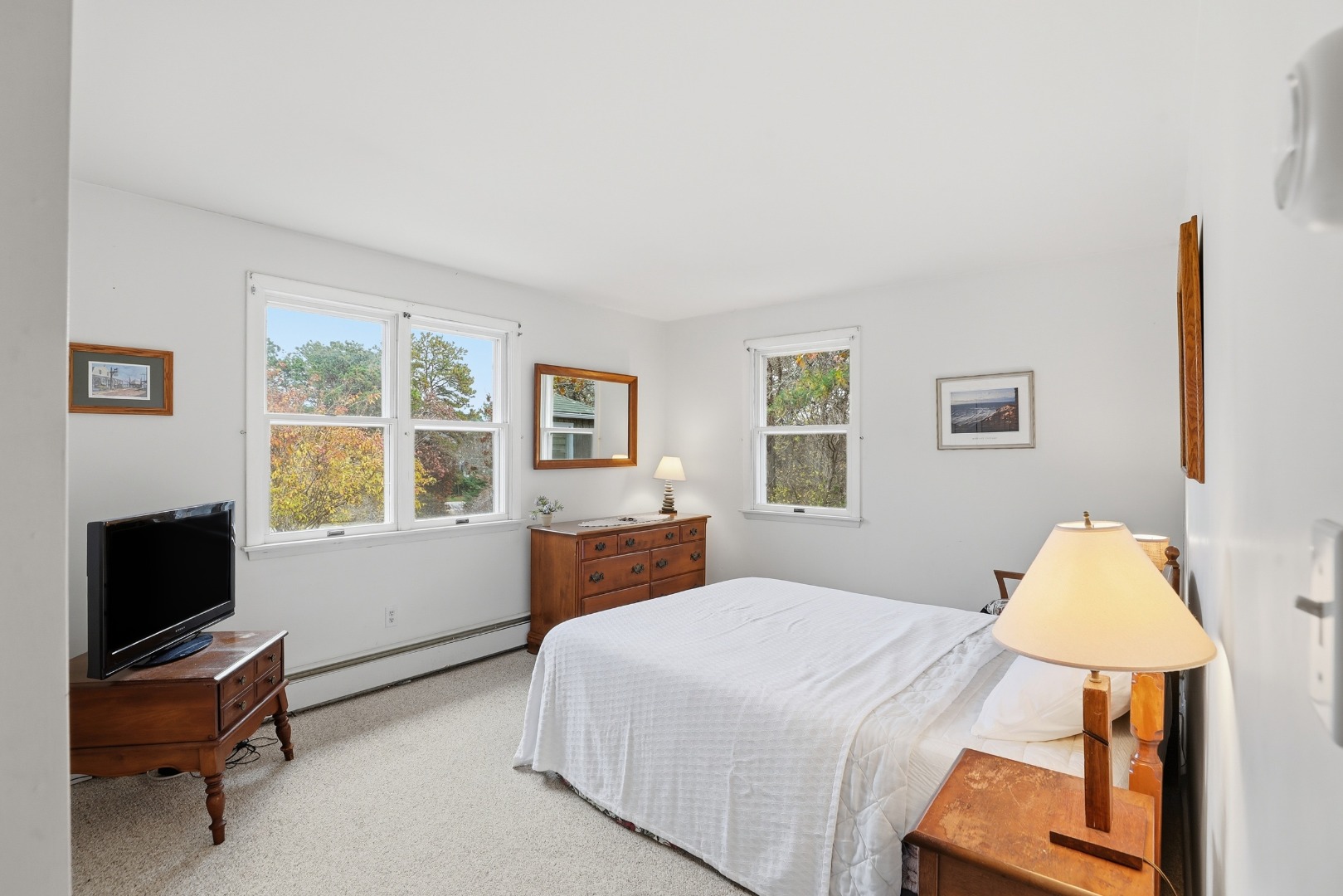 10 Pease Point Road Edgartown, MA 02539 - Photo 11 of 21 a bedroom with a bed and a flat screen tv
