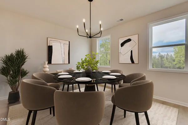 a dining room with furniture and window