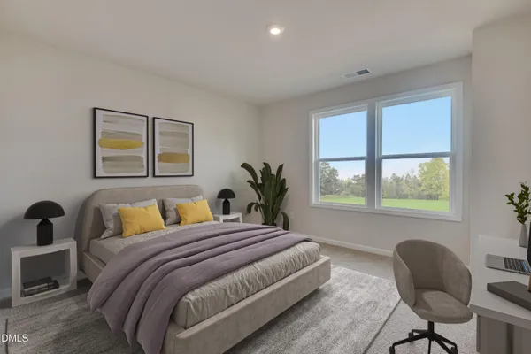 a bedroom with a bed and a chair