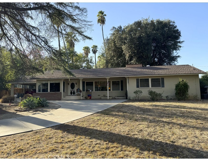5161 Victoria Avenue Riverside, CA 92506 - Photo 1 of 1 a front view of a house with garden