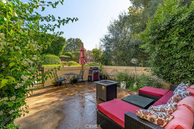 a backyard of a house with outdoor seating