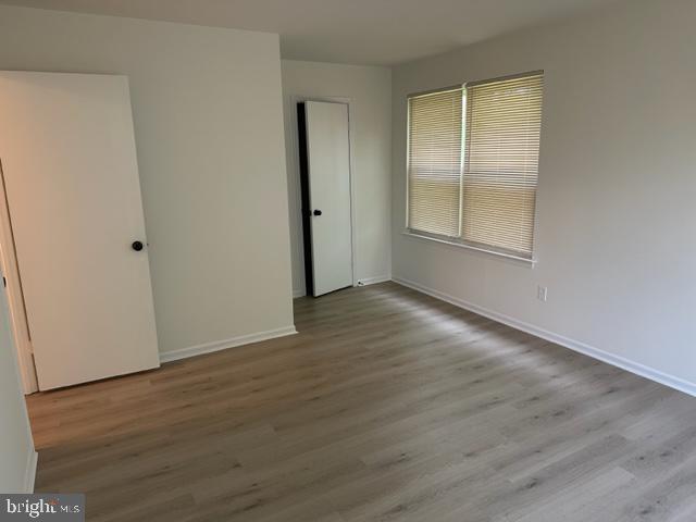 602 South Dove Road, Unit B Yardley, PA 19067 - Photo 13 of 16 an empty room with wooden floor and windows