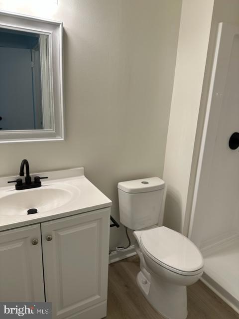 602 South Dove Road, Unit B Yardley, PA 19067 - Photo 16 of 16 a bathroom with a sink a toilet and a mirror