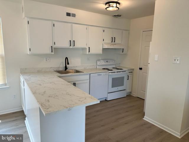 602 South Dove Road, Unit B Yardley, PA 19067 - Photo 6 of 16 a kitchen with granite countertop a sink a stove and cabinets
