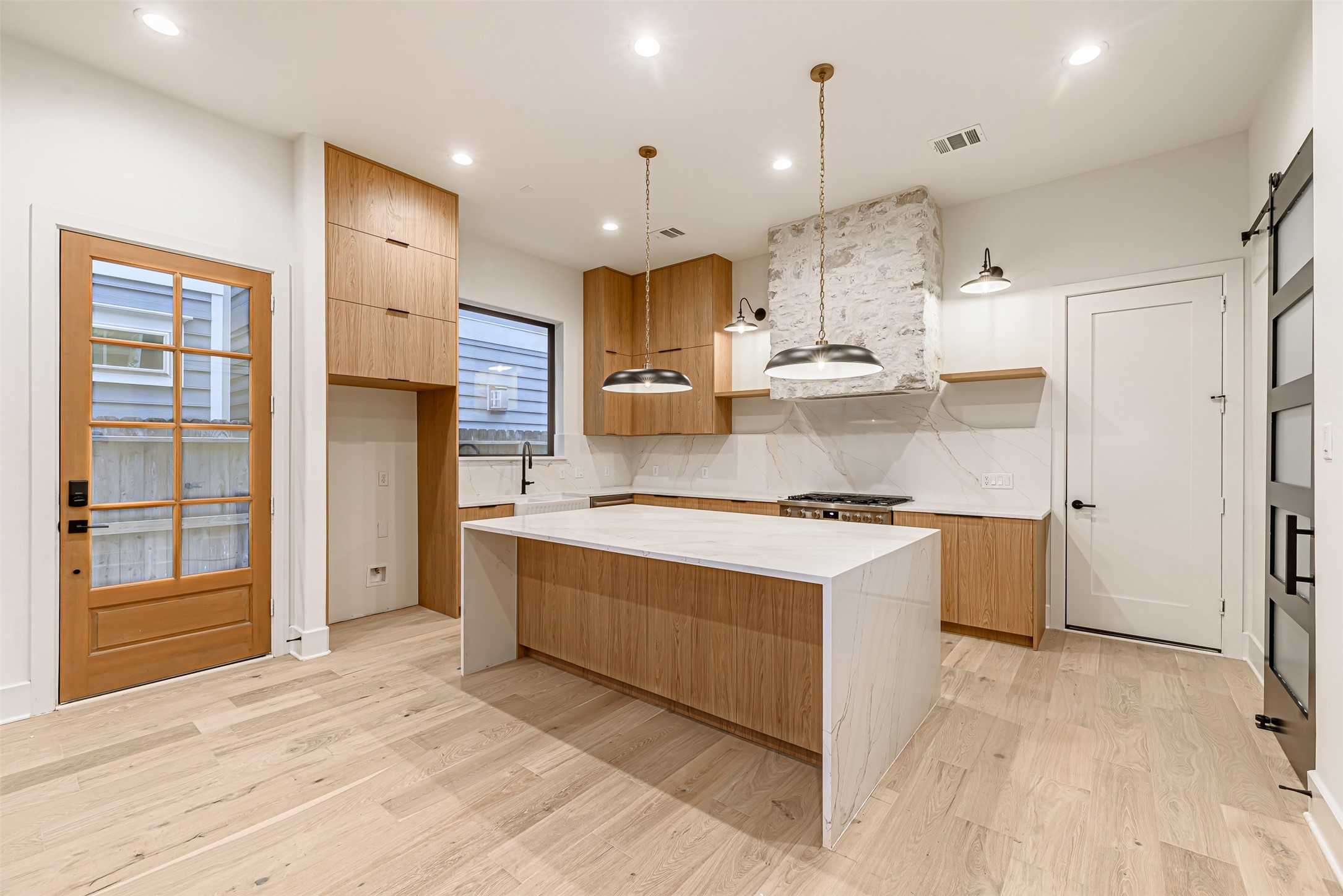 1104 West 9th Street Houston, TX 77007 - Photo 5 of 25 a kitchen with stainless steel appliances granite countertop a stove and a refrigerator