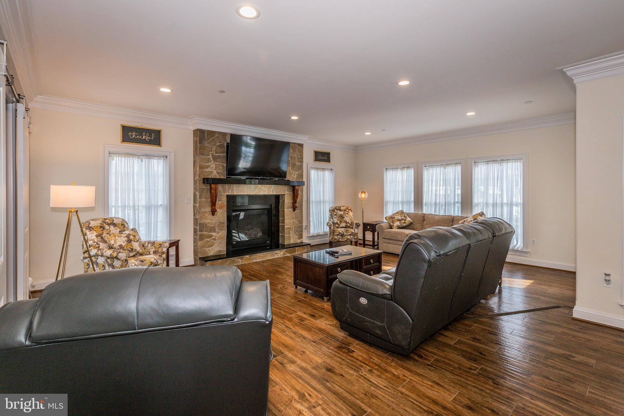 135 Church Road Arnold, MD 21012 - Photo 8 of 69 Gas fireplace with granite surround and mantle