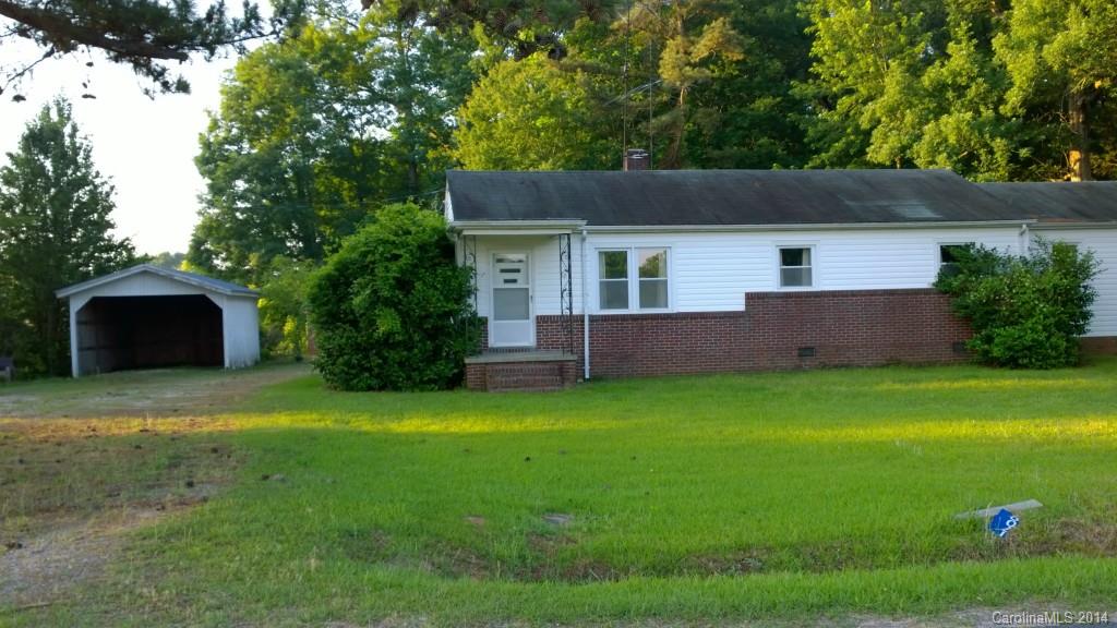 1709 Mayesville Road Morven, NC 28119 - Photo 1 of 21 a front view of a house with a yard and garage