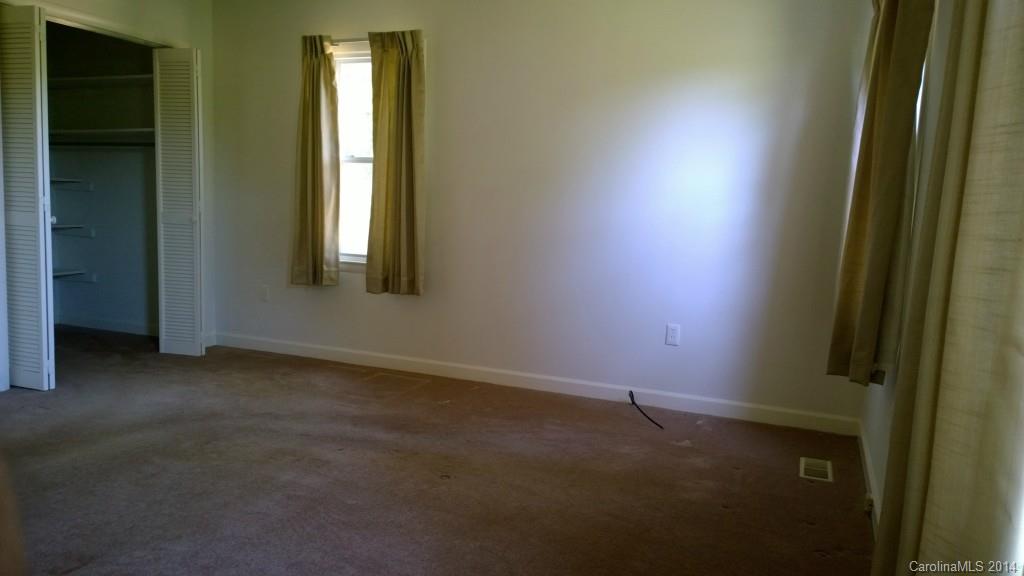 1709 Mayesville Road Morven, NC 28119 - Photo 13 of 21 an empty room with windows and closet