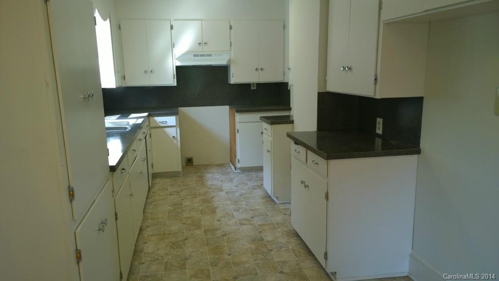 1709 Mayesville Road Morven, NC 28119 - Photo 3 of 21 a kitchen with a refrigerator and cabinets
