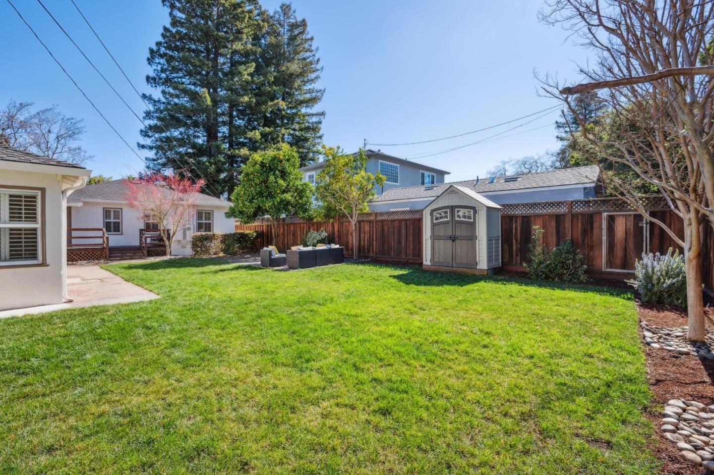 1035 Henderson Avenue Menlo Park, CA 94025 - Photo 14 of 38 a front view of house with yard and green space