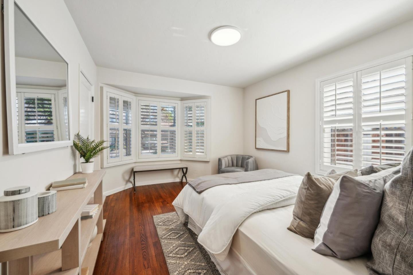 1035 Henderson Avenue Menlo Park, CA 94025 - Photo 19 of 38 a large bed sitting in a bedroom next to a window