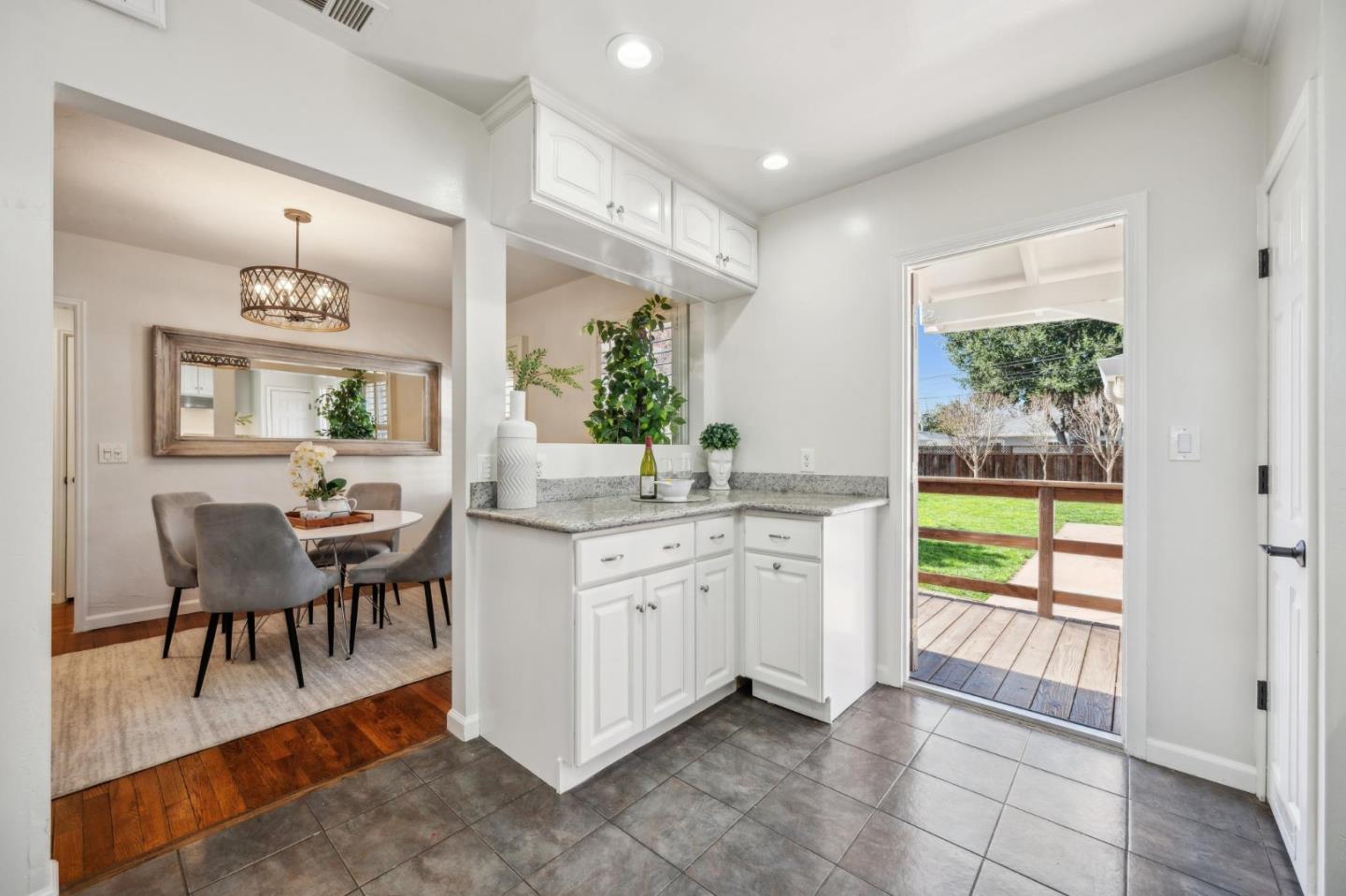 1035 Henderson Avenue Menlo Park, CA 94025 - Photo 21 of 38 a room with kitchen island granite countertop furniture and a large window