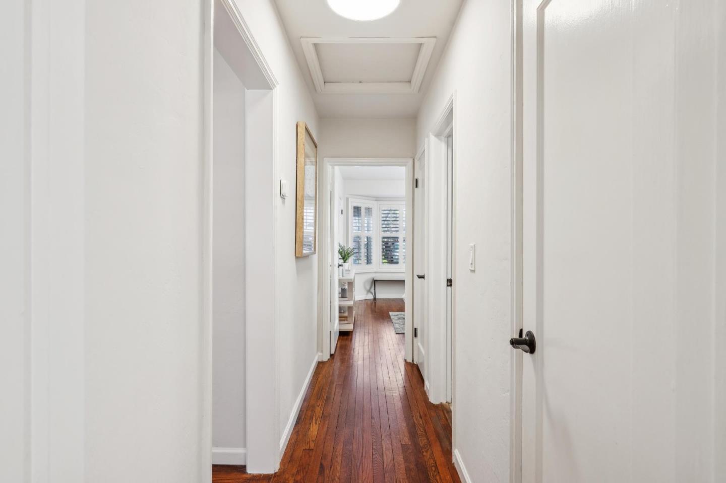 1035 Henderson Avenue Menlo Park, CA 94025 - Photo 22 of 38 a view of a hallway with wooden floor and staircase