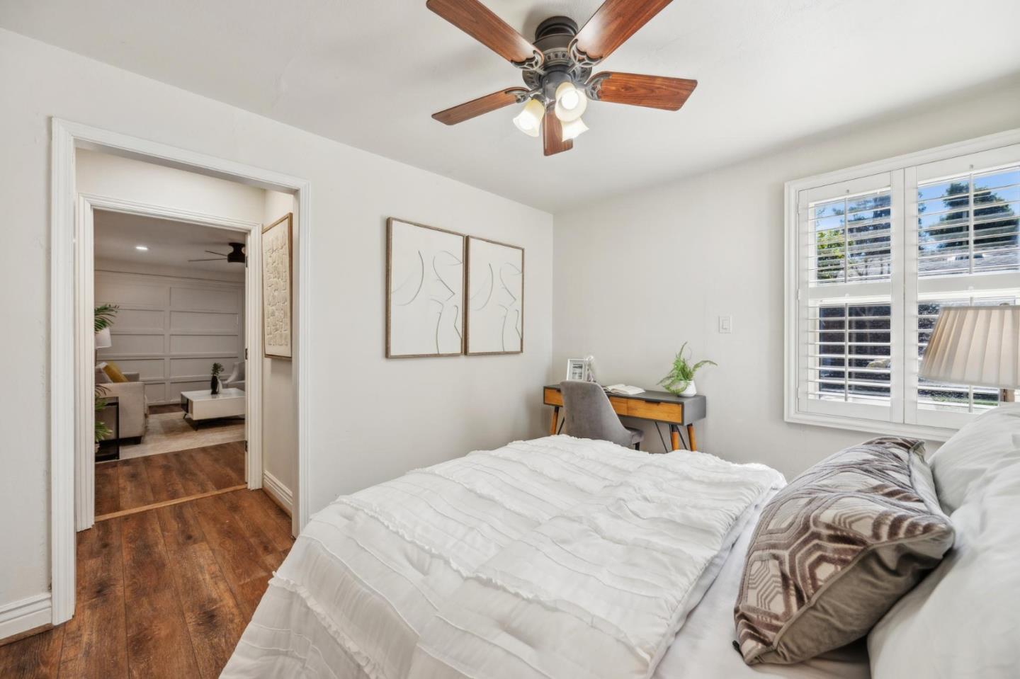1035 Henderson Avenue Menlo Park, CA 94025 - Photo 31 of 38 a bedroom with a large bed and a chandelier fan