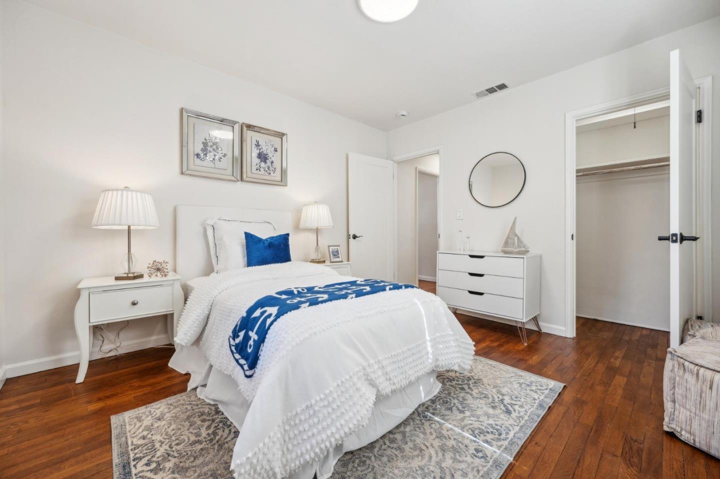 1035 Henderson Avenue Menlo Park, CA 94025 - Photo 5 of 38 a spacious bedroom with a bed and wooden floor