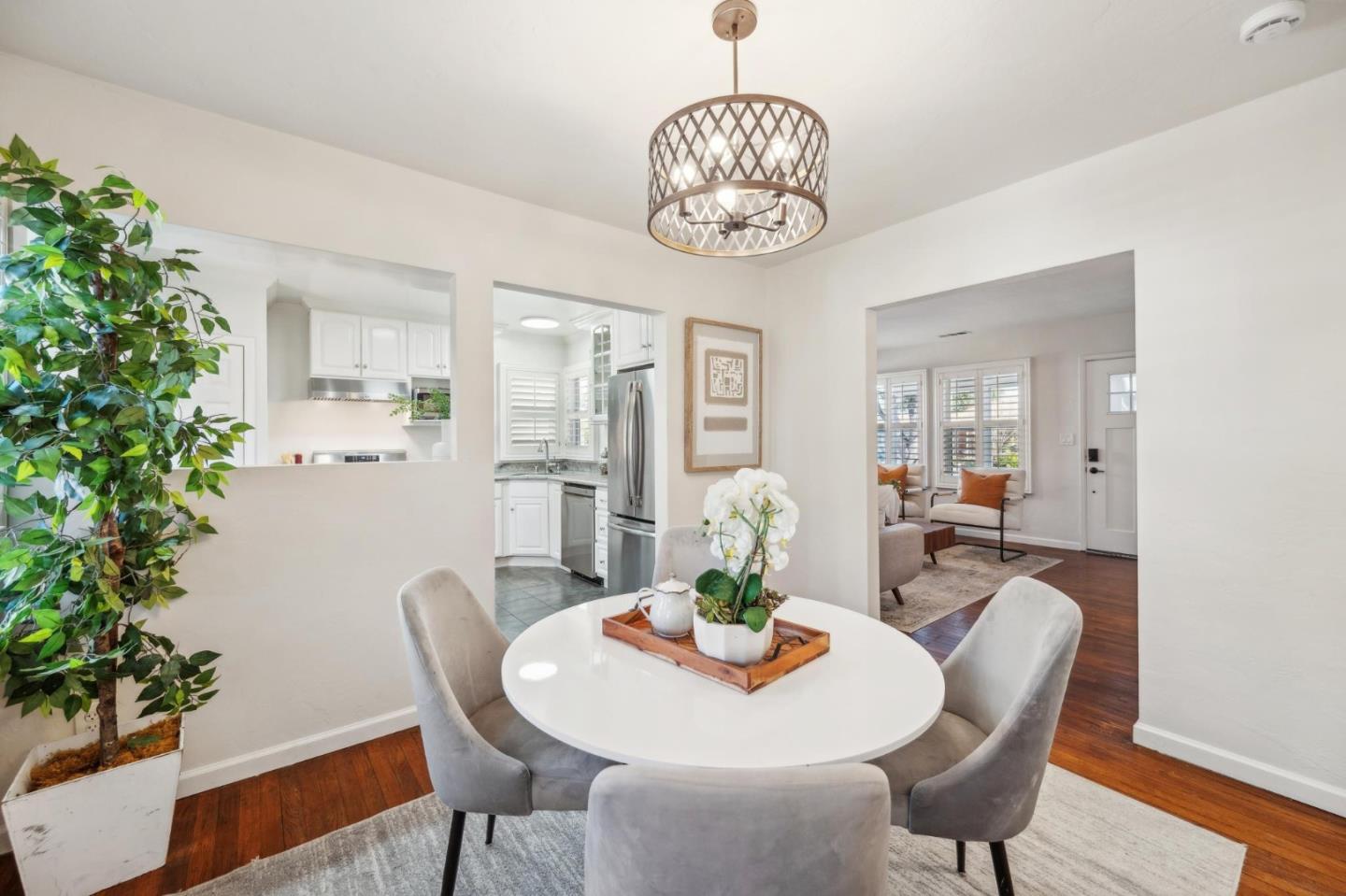 1035 Henderson Avenue Menlo Park, CA 94025 - Photo 8 of 38 a view of a dining room with furniture wooden floor and chandelier