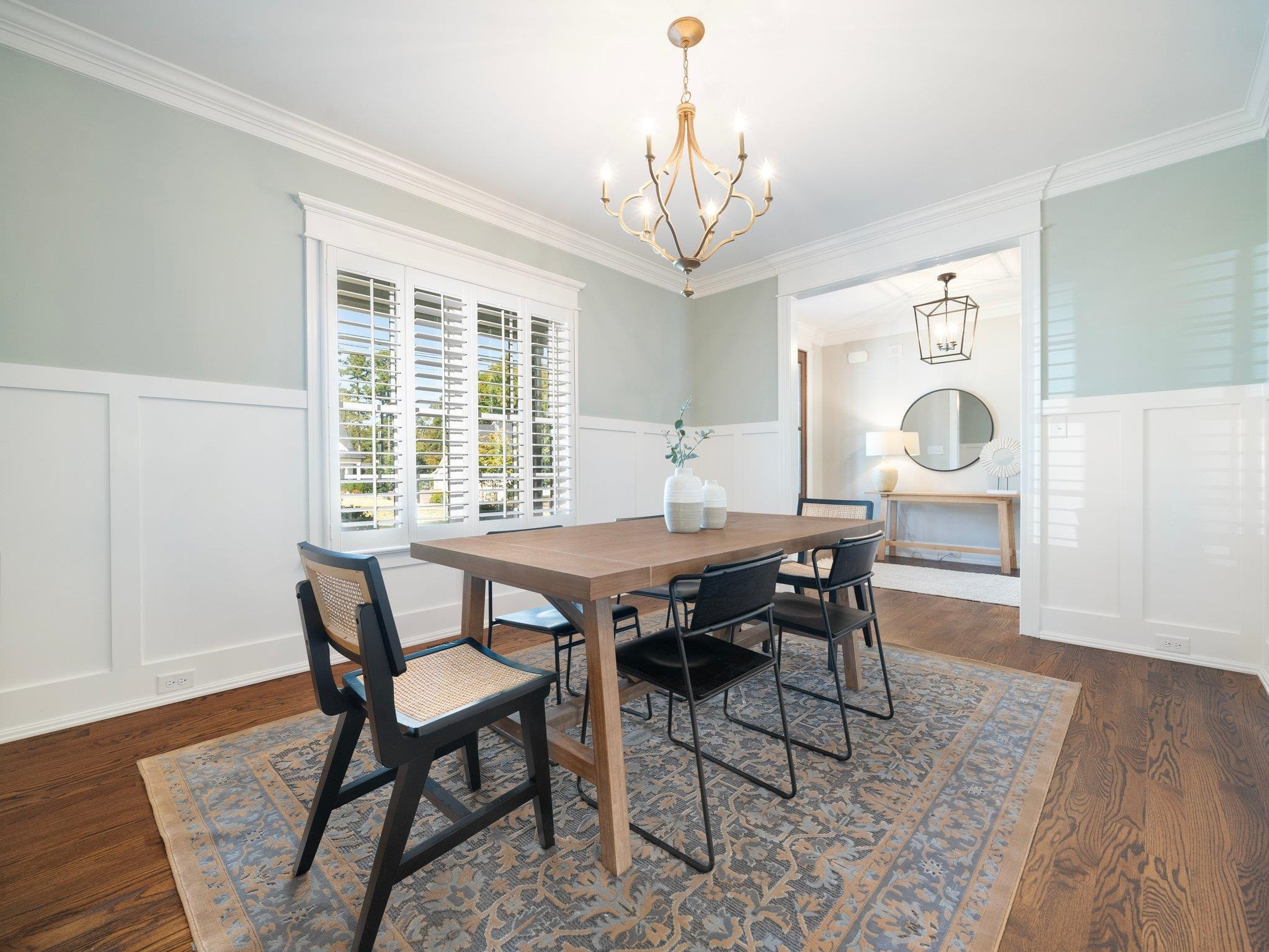 404 Ortega Road Raleigh, NC 27609 - Photo 7 of 43 a view of a dining room with furniture window and wooden floor