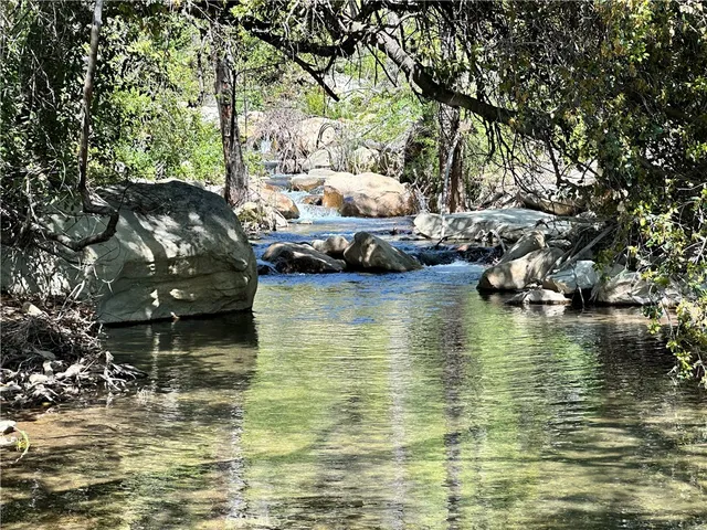 a living room with furniture or outdoor view and a large window