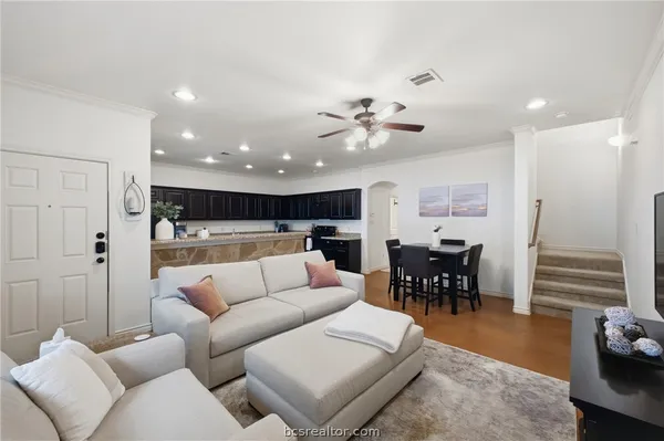 a view of a livingroom with furniture and a chandelier
