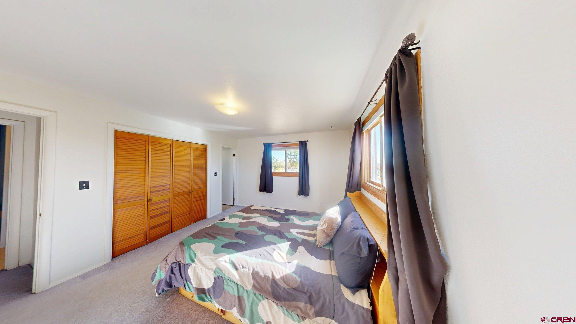 930 County Road 229 Durango, CO 81301 - Photo 12 of 32 a bed room with a bed and a window