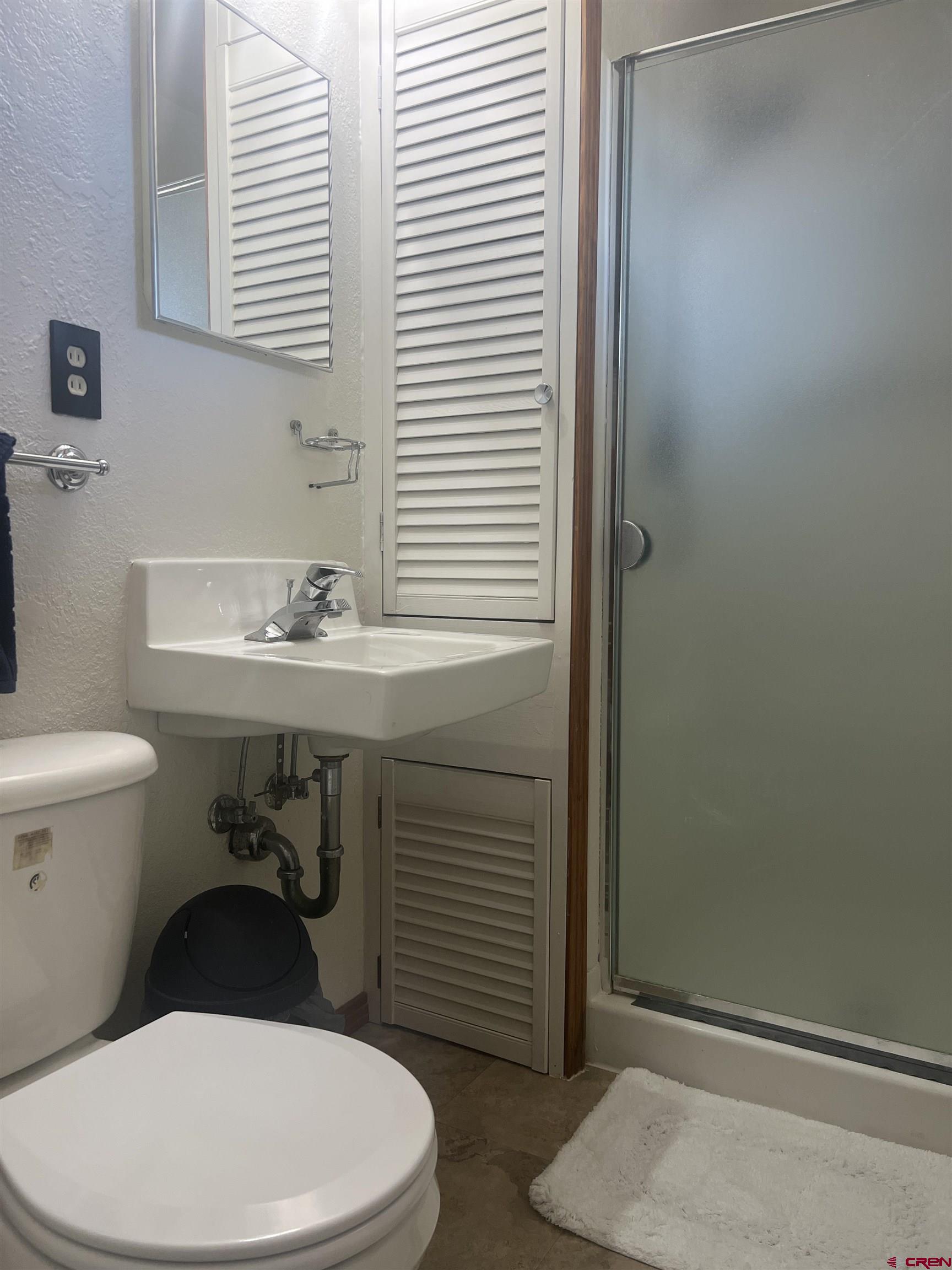 930 County Road 229 Durango, CO 81301 - Photo 13 of 32 a bathroom with a sink a toilet and a window