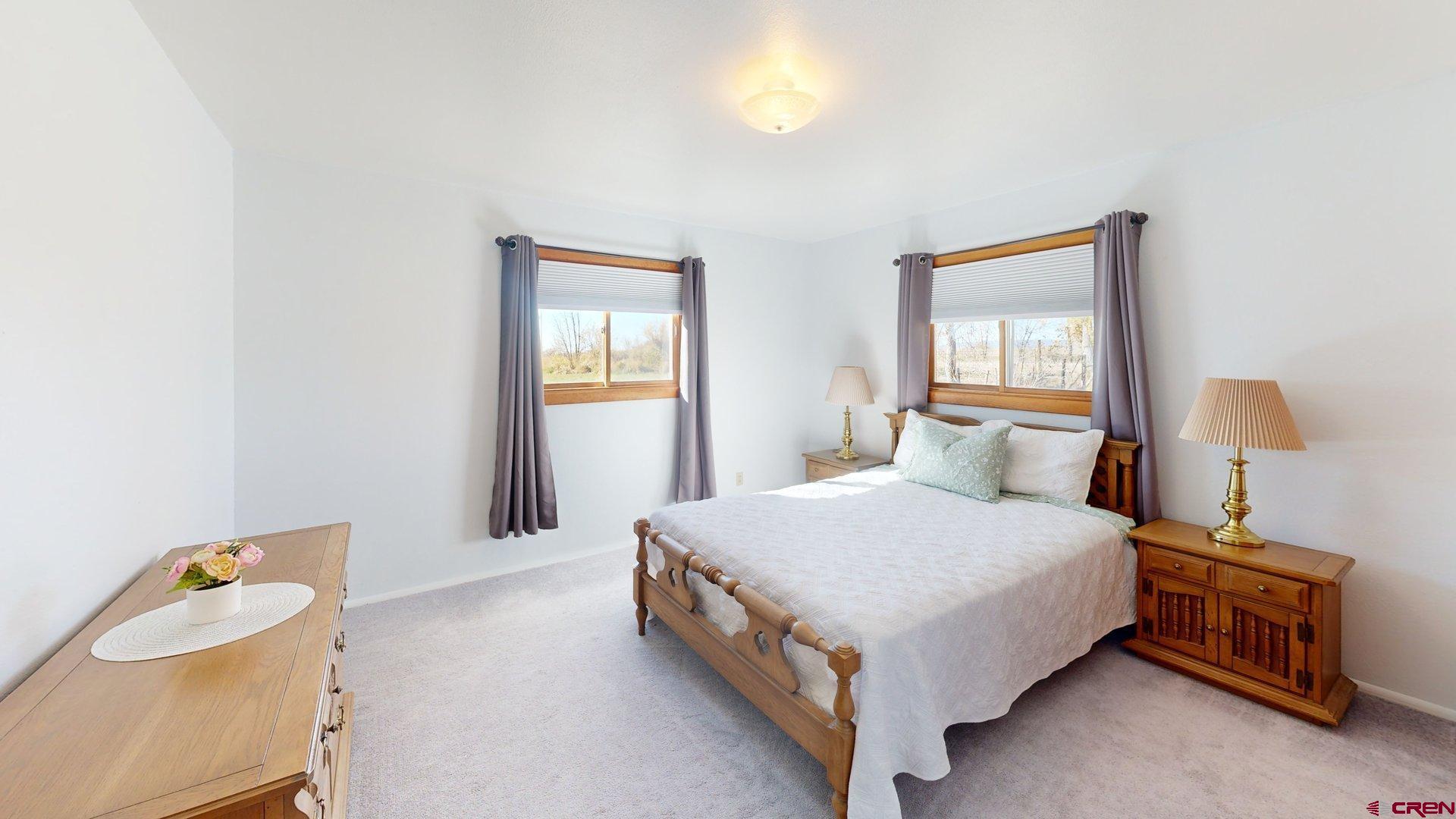 930 County Road 229 Durango, CO 81301 - Photo 14 of 32 a bedroom with a bed and a window