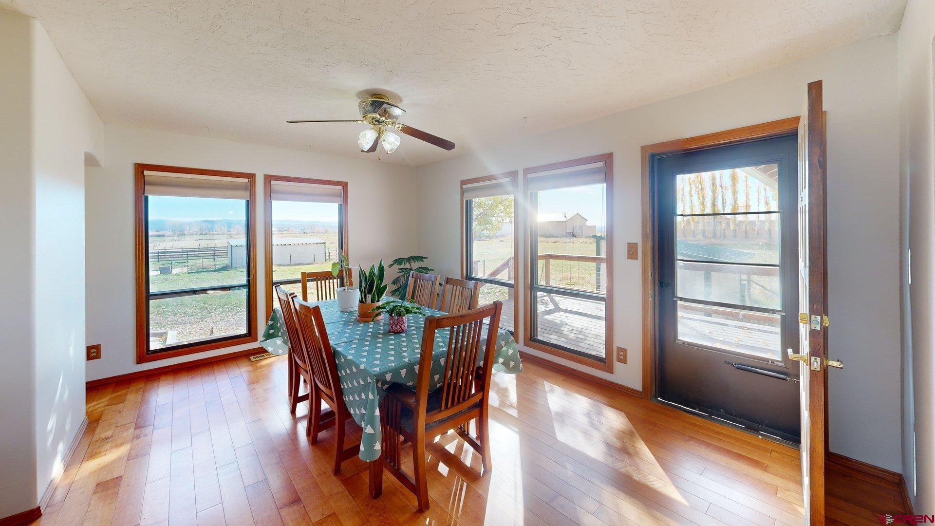 930 County Road 229 Durango, CO 81301 - Photo 17 of 32 a view of a dining room with furniture window and wooden floor