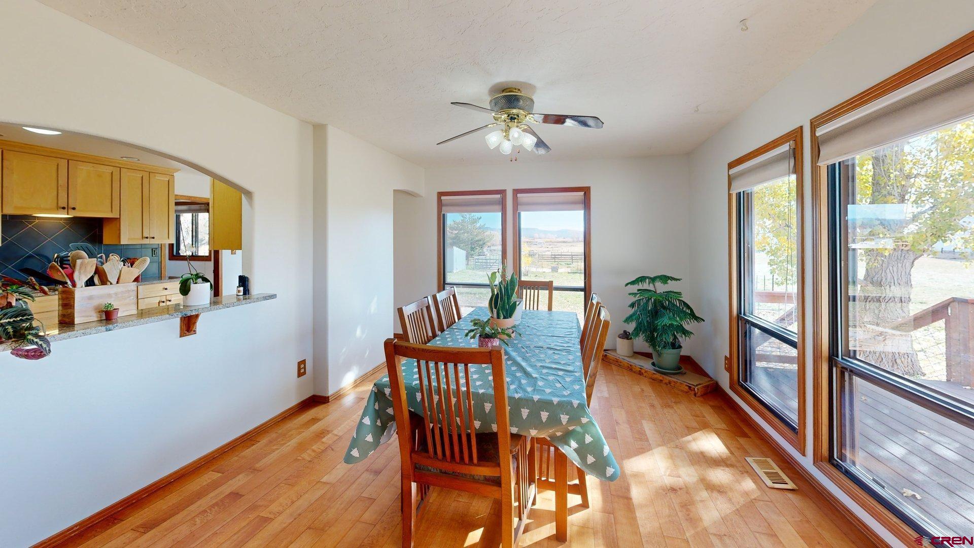 930 County Road 229 Durango, CO 81301 - Photo 18 of 32 a dining room with furniture garden view and wooden floor