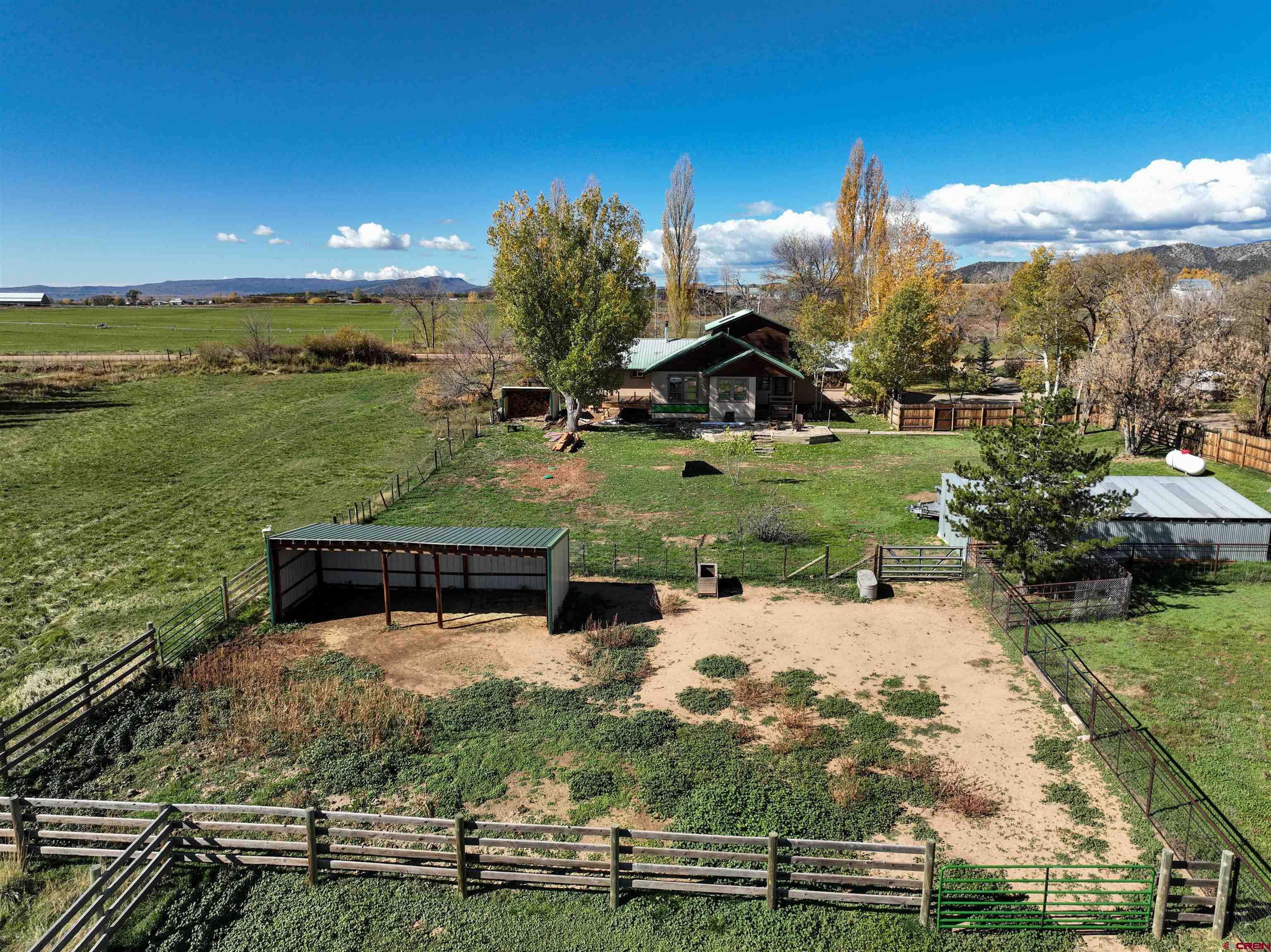 930 County Road 229 Durango, CO 81301 - Photo 5 of 32 a view of a lake with a house in the background