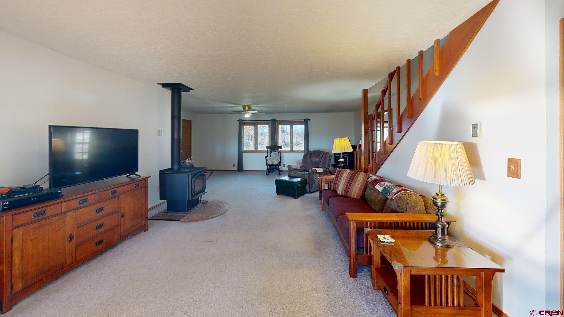 930 County Road 229 Durango, CO 81301 - Photo 10 of 32 a living room with furniture and a flat screen tv