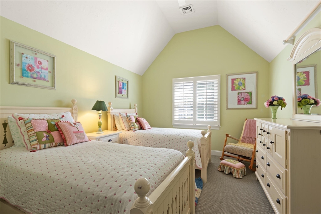 54 Greensward Circle Mashpee, MA 02649 - Photo 28 of 42 a bedroom with a bed and wooden floor