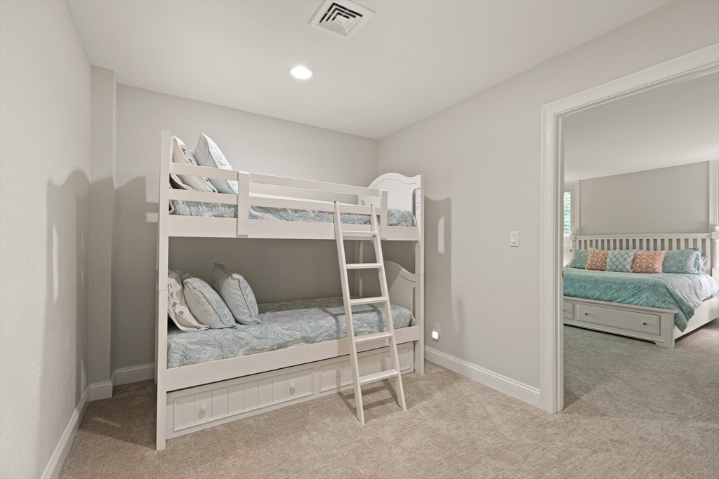 54 Greensward Circle Mashpee, MA 02649 - Photo 34 of 42 a bedroom with a bed and a couch