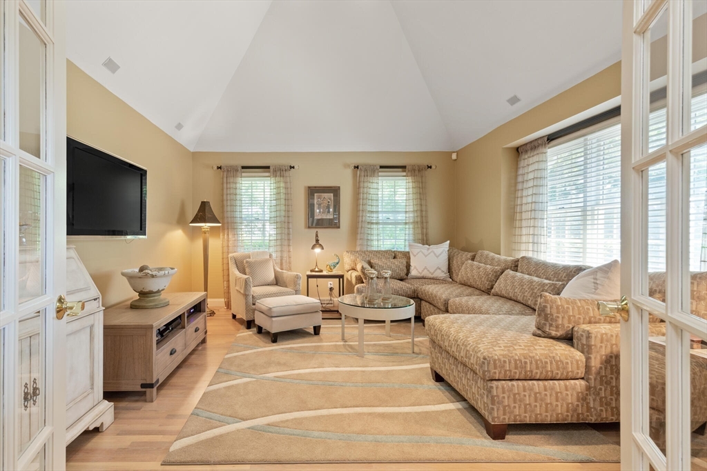 54 Greensward Circle Mashpee, MA 02649 - Photo 6 of 42 a living room with furniture and a flat screen tv