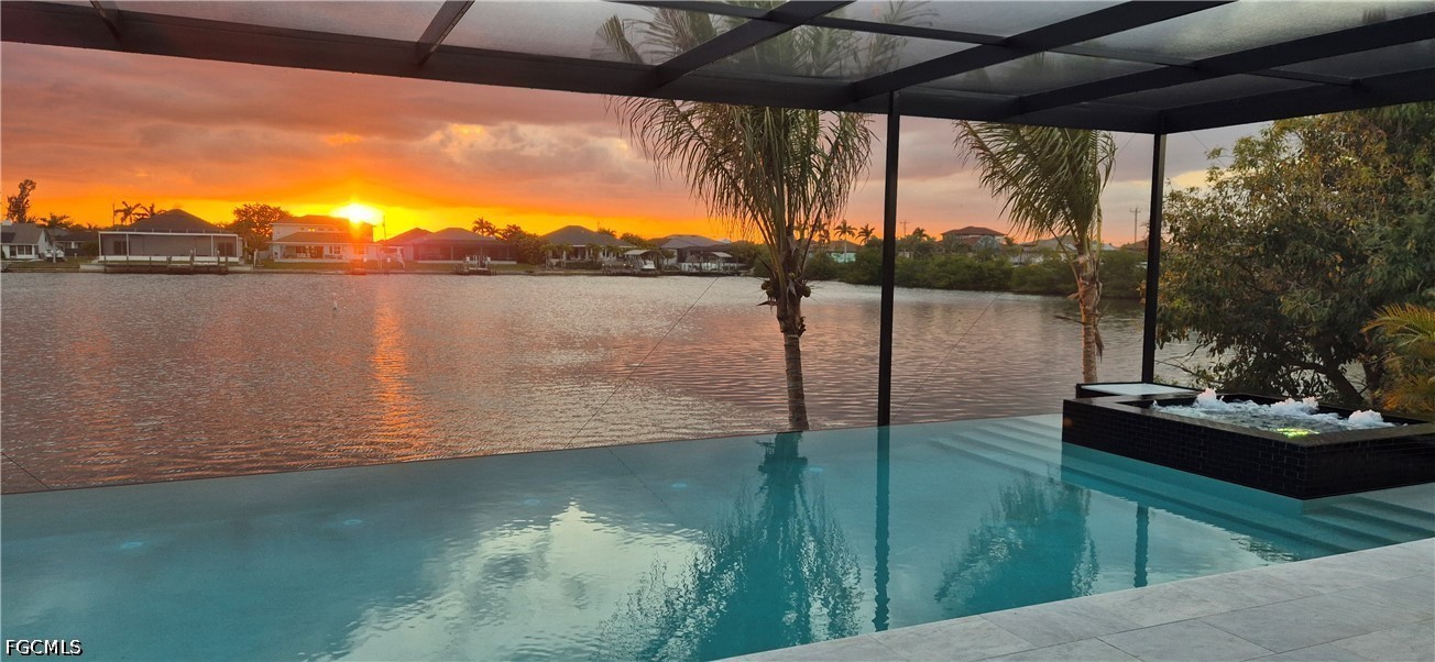 14 Burnt Store Road Cape Coral, FL 33991 - Photo 2 of 30 a view of a lake from a balcony