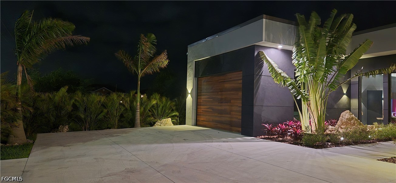 14 Burnt Store Road Cape Coral, FL 33991 - Photo 26 of 30 a view of a house with a yard and potted plants